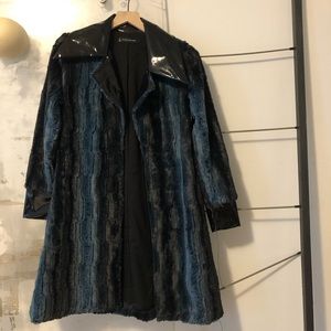 comfy & fashion forward coat with vinyl detail.